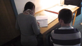 Megan and Arthur are recording the details of each image.