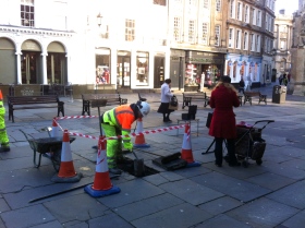 Council workmen making good the spot where the Christmas tree stood.