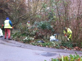 Sainsbury's staff clearing up riverside rubbish/ and cutting back the overgrowth.